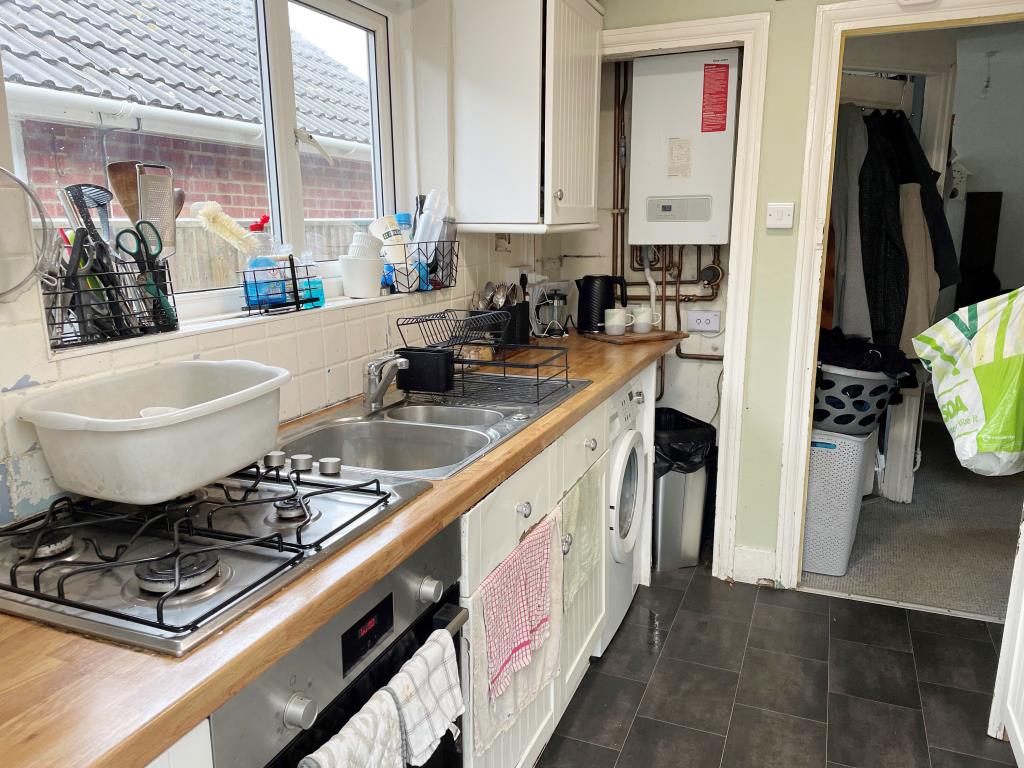 Lot: 65 - DETACHED BUNGALOW IN NEED OF UPDATING - View of kitchen at rear